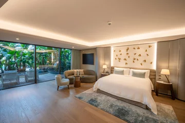 Fotobehang Hotel chique Modern hotel room with a bright and airy feel, a luxury hotel room. Example of a hotel room, modern furnishings and architecture.  © ismailbasdas
