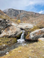 Small Mountain Stream Cascading Through Rocky Terrain – Serene Nature Landscape