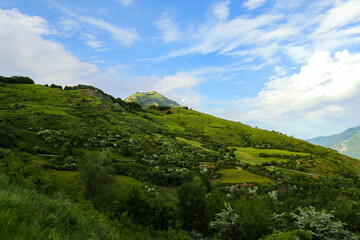 A breathtaking landscape of the Apennine Mountains in Tuscany-Emilia, showcasing stunning natural beauty with rolling hills, lush greenery, and picturesque views of the Italian countryside.