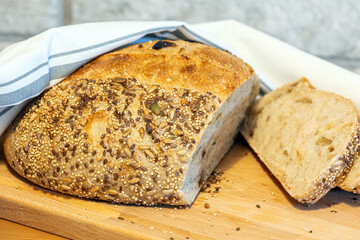 Homemade bread, sourdough wheat loaf with seeds