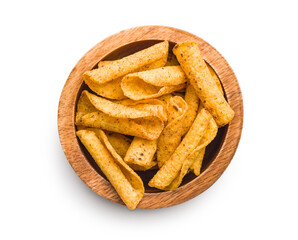 Rolled nachos tortilla chips in boowl isolated on white background.