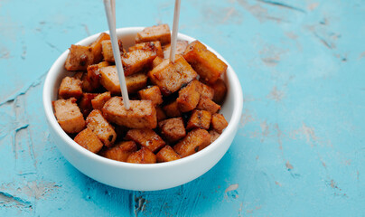 marinated tofu cubes with wooden skewers
