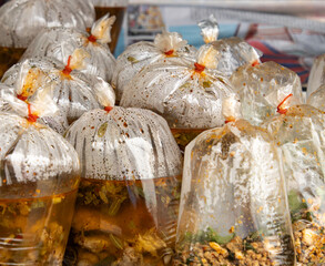 A bunch of plastic bags with food inside