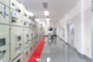 Blur image of electrical switchgear room of Industrial electrical power plant.