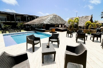 Tropical Resort Lounge Area With Pool and Comfortable Outdoor Furniture