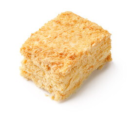 Delicious square of layered dessert made from cream, sugar, and flaky pastry enjoyed in a cozy cafe setting