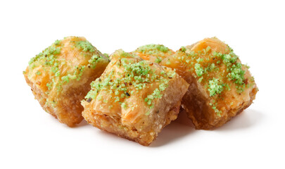 Delicious dessert featuring sweet layers of pastry filled with nuts and topped with green pistachio garnish
