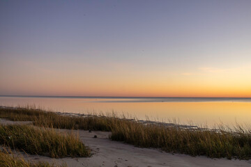 Various stages of the sunset as seen from the beach area near the St. Marks Wildlife Refuge lighthouse in Florida.