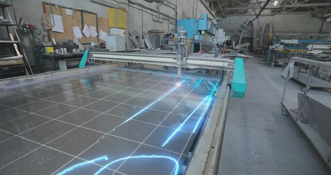 CNC plasma cutting machine at work. metal plasma cutting machine. CNC plasma machine at the factory. Cutting metal with a plasma CNC machine.