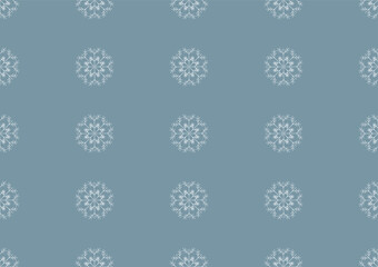 Seamless pattern with snowflakes on a blue background. Christmas wallpaper or fabric.