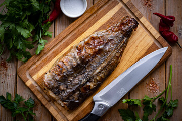 Stuffed fish. Gefilte fish on a wooden board. A hearty lunch. View from above. Close-up.