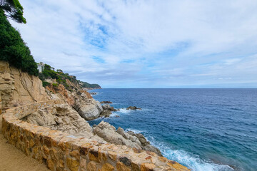 Scenic Coastal Path with Rocky Cliffs and Ocean Views