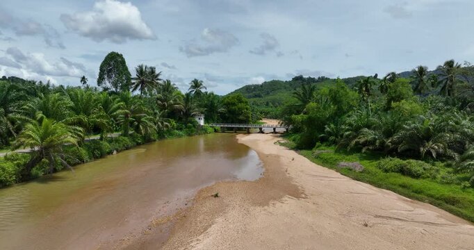 An aerial drone video on Plai Wha river at Phang Nga, Surat Thani, Thailand, river and forest, nature.