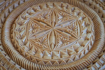wooden carved pattern on the board
