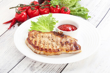 Grilled pork steak with ketchup