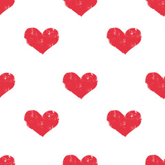 Cute hand drawn seamless pattern. Festive packaging for Valentine's Day. Textured red hearts on a white background. Imitation of a child's drawing.