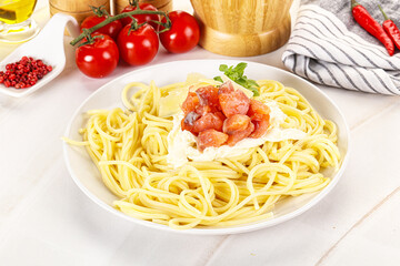 Pasta spaghetti with salmon and stracciatella