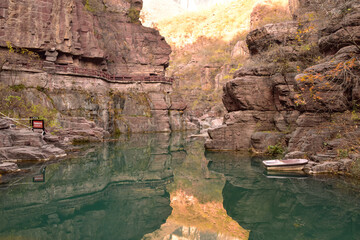 Sunlight Bathes the Canyon Walls and River at Yuntaishan in China
