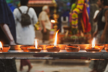 Burning Prayer Candles in front of Praying Crowds 