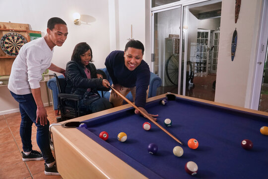 Friends playing pool