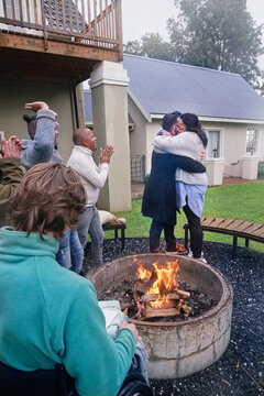 Disabled friends around fire pit