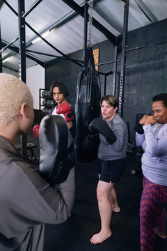 People practicing box in gym