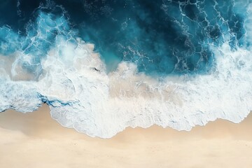 Fototapeta premium Turquoise ocean waves are crashing on a pristine sandy beach, creating a mesmerizing contrast of colors and textures in this stunning aerial view