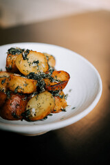 Fried Potatoes With Herbs Served Beautifully on a White Plate, Ideal for a Comforting Meal or Side Dish