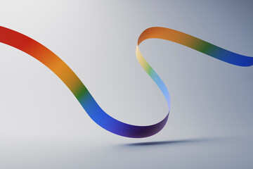 Multi colored ribbon over gray background