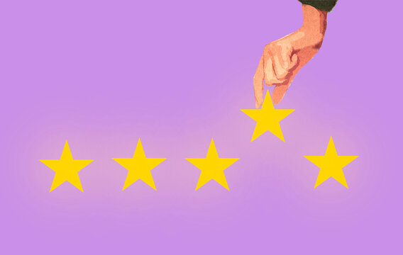 Hand picking star from row against lavender background