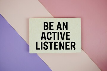 Be An Active Listener text on paper card on purple and pink geometric background