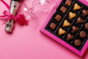 A glasses of champagne elegantly paired with a box of rich chocolates