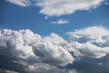Vibrant Blue Sky with Fluffy White Clouds on a Clear Day
