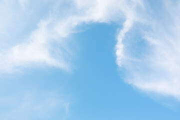 Serene Blue Skies with Soft White Clouds for Atmospheric Stock Photography