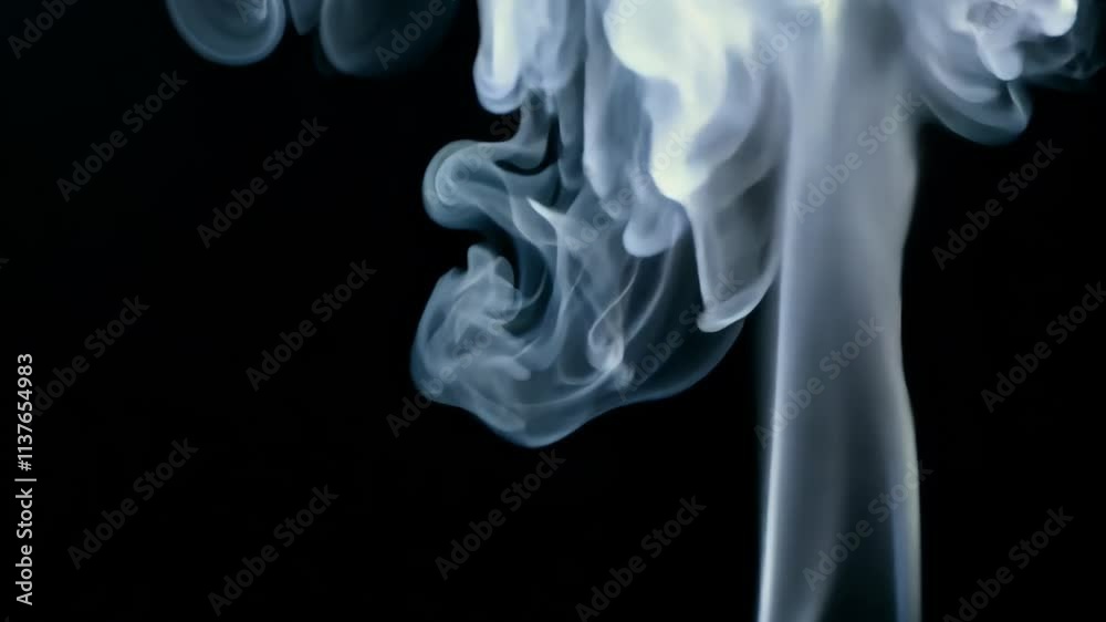 Aufkleber Smoke swirls and dances in the air creating mesmerizing patterns against a black background