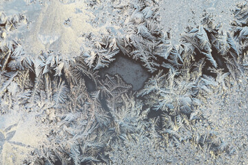 Frosty Ice Patterns on Frozen Surface - Close-up of Natural Winter Abstract Background