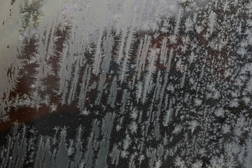 Elegant Frost Patterns on a Window with Delicate Ice Crystals