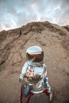 Spaceman on a nameless planet, taking rock samples