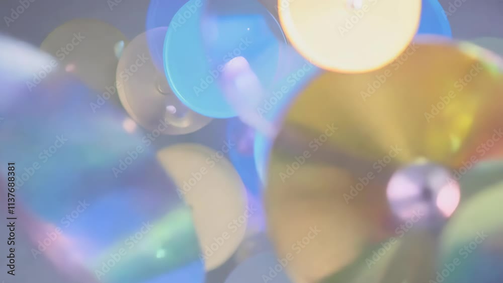 Poster Colorful circular shapes float and move in water creating an abstract visual effect in a serene setting