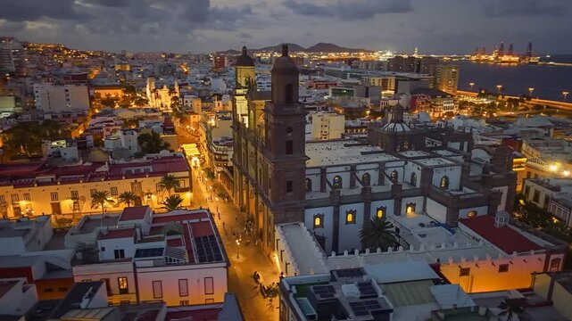 Fly over Catedral de Canarias in Vegueta district, Las Palmas de Gran Canaria. Aerial view of Las Palmas de Gran Canaria, Spain after sunset