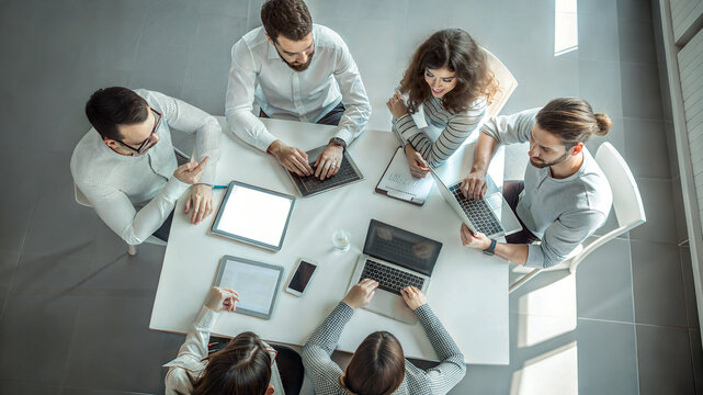 overhead shoot business panel office meeting collaborating large round table board room