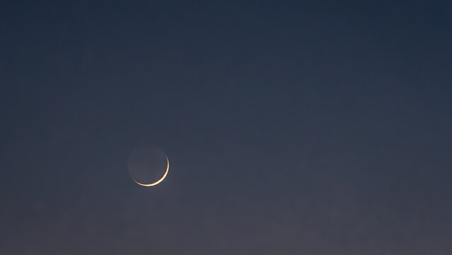 Serene Crescent Moon in Twilight Sky