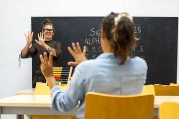 Sign language class with instructor and student in classroom