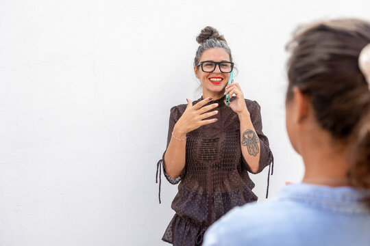 Woman Communicating with Sign Language in a Lesson