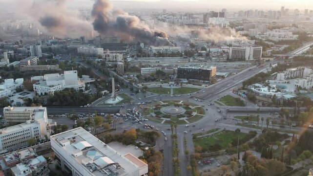 Smoke rises from air strikes on Damascus.