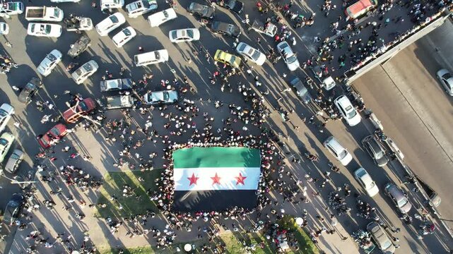 Aerial view of Damascus. Syrians celebrating the fall of Bashar al-Assad's regime. 