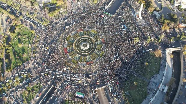 Aerial view of Damascus. Syrians celebrating the fall of Bashar al-Assad's regime. 