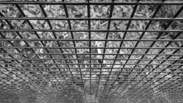 Abstract black and white photo of metal grid pattern