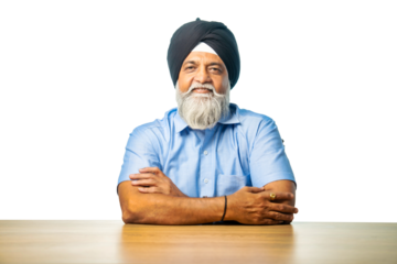 Senior Sikh man sitting at table with white background, expressing various emotions and gestures