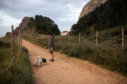Strolling with a Dog on a Scenic Path in Ea, Basque Country